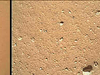 As the last step in a series of inspections of the Mars Hand Lens Imager (MAHLI) aboard NASA's Mars rover Curiosity, this camera's reclosable dust cover was opened for the first time during the 33rd Martian day, or sol, of the rover's mission on Mars (Sept. 8, 2012), enabling MAHLI to take the center image of this set.