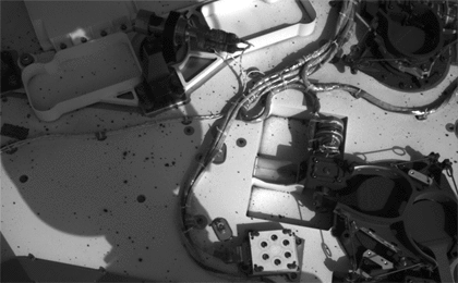 This set of images from NASA's Curiosity rover shows the inlet covers for the Sample Analysis at Mars instrument opening and closing, as the rover continues to check out its instruments in the first phase after landing.