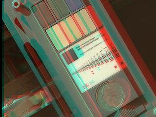 This 3D view of the calibration target for the Mars Hand Lens Imager (MAHLI) aboard NASA's Mars rover Curiosity was assembled from two images taken by that camera during the 34th Martian day, or sol, of Curiosity's work on Mars (Sept. 9, 2012).