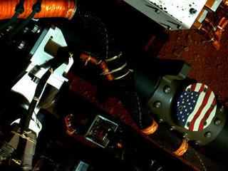This view of the American flag medallion on NASA's Mars rover Curiosity was taken by the rover's Mars Hand Lens Imager (MAHLI) during the 44th Martian day, or sol, of Curiosity's work on Mars (Sept. 19, 2012).