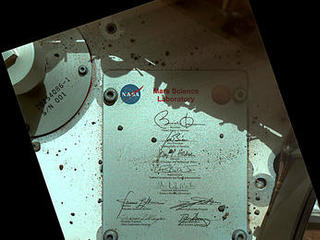 This view of Curiosity's deck shows a plaque bearing several signatures of US officials, including that of President Obama and Vice President Biden.
