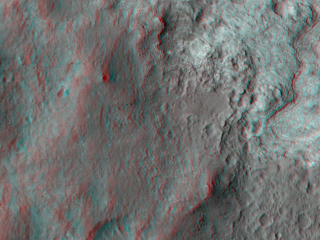 This 3D, or stereo anaglyph, view shows the upcoming science destination for NASA's Mars rover Curiosity, a region dubbed "Glenelg," where three different types of material seen from orbit come together (middle of picture).