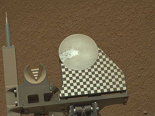 The robotic arm on NASA's Mars rover Curiosity delivered a sample of Martian soil to the rover's observation tray for the first time during the mission's 70th Martian day, or sol (Oct. 16, 2012)