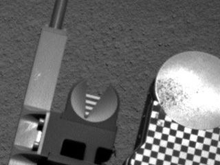 Sample material from the fourth scoop of Martian soil collected by NASA's Mars rover Curiosity is on the rover's observation tray in this image taken during the mission's 78th Martian day, or sol, (Oct. 24, 2012) by Curiosity's left Navigation Camera.