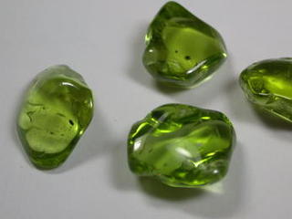 The Martian soil examined by the Chemistry and Mineralogy (CheMin) instrument on NASA's Curiosity rover shows the diffraction signature, or "fingerprint," of the mineral olivine, shown here on Earth in the form of tumbled crystals about a quarter-inch (several millimeters) in size.