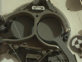 This subframe image from the left Mast Camera (Mastcam) on NASA's Mars rover Curiosity shows the covers in place over two sample inlet funnels of the rover's Sample Analysis at Mars (SAM) instrument suite.