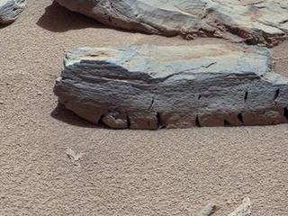 This view of a Martian rock called "Rocknest 3" combines four images taken by the right-eye camera of the Mast Camera (Mastcam) instrument, which has a telephoto, 100-millimeter-focal-length lens.