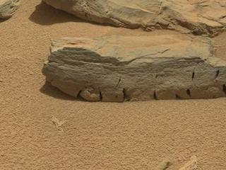 This view of a Martian rock called "Rocknest 3" combines four images taken by the right-eye camera of the Mast Camera (Mastcam) instrument, which has a telephoto, 100-millimeter-focal-length lens.