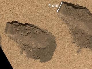This is a view of the third (left) and fourth (right) trenches made by the 1.6-inch-wide (4-centimeter-wide) scoop on NASA's Mars rover Curiosity in October 2012.