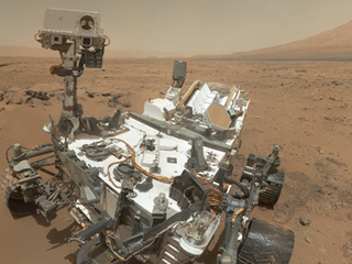 NASA's Curiosity Mars rover documented itself in the context of its work site, an area called "Rocknest Wind Drift," on the 84th Martian day, or sol, of its mission (Oct. 31, 2012).