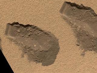 This is a view of the third (left) and fourth (right) trenches made by the 1.6-inch-wide (4-centimeter-wide) scoop on NASA's Mars rover Curiosity in October 2012.