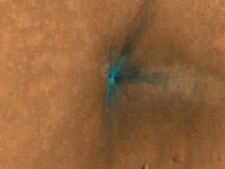 This image from the NASA Mars Reconnaissance Orbiter shows an impact scar on Mars made by pieces of the NASA Mars Science Laboratory spacecraft that the spacecraft shed just before entering the Martian atmosphere.
