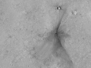 This image from the NASA Mars Reconnaissance Orbiter shows an impact scar on Mars made by pieces of the NASA Mars Science Laboratory spacecraft that the spacecraft shed just before entering the Martian atmosphere.