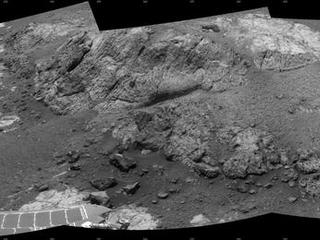 This 180-degree mosaic of images from the navigation camera on the NASA Mars Exploration Rover Opportunity shows terrain near the rover during the 3,153rd Martian day, or sol, of the rover's work on Mars (Dec. 6, 2012).