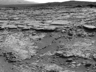 The sinuous rock feature in the lower center of this mosaic of images recorded by the NASA Mars rover Curiosity is called "Snake River."