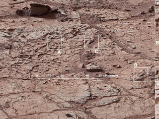 This view shows the patch of veined, flat-lying rock selected as the first drilling site for NASA's Mars rover Curiosity.