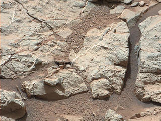 This image of an outcrop at the "Sheepbed" locality, taken by NASA's Curiosity Mars rover with its right Mast Camera (Mastcam), shows well-defined veins filled with whitish minerals, interpreted as calcium sulfate.