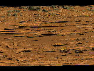 The "Shaler" outcrop is dramatically layered, as seen in this mosaic of telephoto images from the right Mast Camera (Mastcam) on NASA's Mars rover Curiosity.