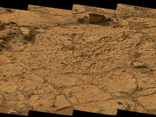 This wide view of the 'John Klein' location selected for the first rock drilling by NASA's Mars rover Curiosity is a mosaic taken by Curiosity's right Mast Camera (Mastcam) during the afternoon of the 153rd Martian day, or sol, of the rover's work on Mars.