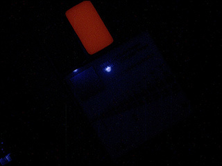 This image of a calibration target illuminated by ultraviolet LEDs (light emitting diodes) is part of the first set of nighttime images taken by the Mars Hand Lens Imager (MAHLI) camera at the end of the robotic arm of NASA's Mars rover Curiosity.