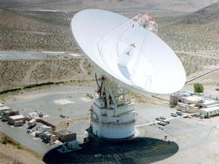 The 70m antenna at Goldstone, California against the background of the Mojave desert.