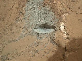 The bit in the rotary-percussion drill of NASA's Mars rover Curiosity left its mark in a target patch of rock called "John Klein" during a test on the rover's 176th Martian day, or sol (Feb. 2, 2013), in preparation for the first drilling of a rock by the rover.