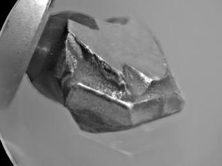 The shape of the tip of the bit in the drill of NASA's Mars rover Curiosity is apparent in this view recorded by the remote micro-imager in the rover's Chemistry and Camera instrument during the 172nd Martian day, or sol, of Curiosity's work on Mars (Jan. 29, 2012).