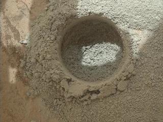 After an activity called the "mini drill test" by NASA's Mars rover Curiosity, the rover's Mars Hand Lens Imager (MAHLI) camera recorded this close-up view of the results during the 180th Martian day, or sol, of the rover's work on Mars (Feb. 6, 2013).