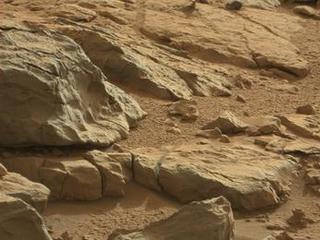 A shiny-looking Martian rock is visible in this image taken by NASA's Mars rover Curiosity's Mast Camera (Mastcam) during the mission's 173rd Martian day, or sol (Jan. 30, 2013).