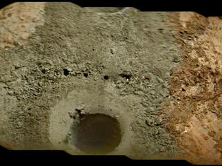 A day after NASA's Mars rover Curiosity drilled the first sample-collection hole into a rock on Mars, the rover's Chemistry and Camera (ChemCam) instrument shot laser pulses into the fresh rock powder that the drilling generated.