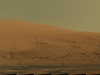 This mosaic of images from the Mast Camera (Mastcam) on NASA's Mars rover Curiosity shows Mount Sharp in raw color as recorded by the camera.