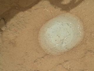 The gray area in the center of this image is where the Dust Removal Tool on the robotic arm of NASA's Mars rover Curiosity brushed a rock target called "Wernecke."