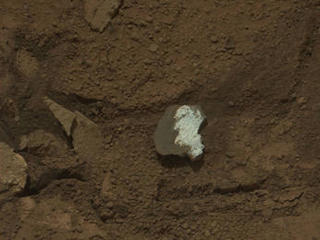 This raw image of "Tintina," a broken rock fragment in a rover wheel track, was taken by Curiosity's Mast Camera (Mastcam).