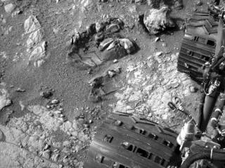 This view of Curiosity's left-front and left-center wheels and of marks made by wheels on the ground in the "Yellowknife Bay" area comes from one of six cameras used on Mars for the first time more than six months after the rover landed.