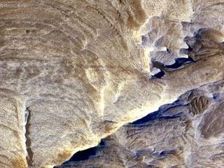 The image was acquired during winter in Mars' southern hemisphere. It combines separate band passes taken by the High Resolution Imaging Science Experiment in blue-green light, red light and near-infrared light.
