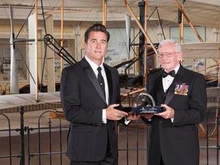 The leader of the entry, descent and landing team of NASA's Mars Science Laboratory project, Adam Steltzner of JPL (left), accepts the 2013 Trophy for Current Achievement from the Smithsonian National Air and Space Museum from museum director Gen. J. R. "Jack" Dailey on April 24, 2013.