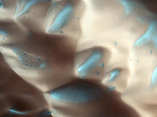 Dunes are often found on crater floors. In the winter, at high northern latitudes, the terrain is covered by carbon-dioxide ice (dry ice).