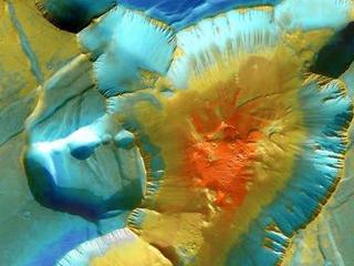 A false-color mosaic focuses on one junction in Noctis Labyrinthus where Mars canyons meet to form a depression 4,000 meters (13,000 feet) deep.