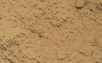 This pair of images from the Mars Hand Lens Imager (MAHLI) on NASA's Mars rover Curiosity shows the rock target "Cumberland" before and after Curiosity drilled into it to collect a sample for analysis.
