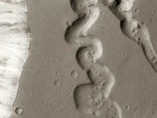 This image shows two small tributaries, just east of where they join Shalbatana Vallis.