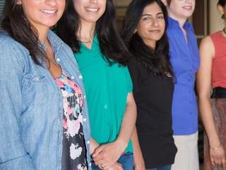Pictured here are some of the women working on the Curiosity rover.  The picture was taken in the working "garage" where Curiosity's ground test rover is housed in the "Mars Yard," a simulated martian landscape right at JPL.