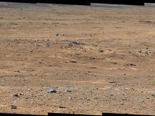 An outcrop visible as light-toned streaks in the lower center of this image has been chosen as a place for NASA's Mars rover Curiosity to study for a few days in September 2013.