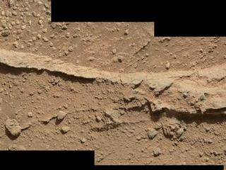 This mosaic of four images taken by the Mars Hand Lens Imager (MAHLI) camera on NASA's Mars rover Curiosity shows detailed texture in a ridge that stands higher than surrounding rock.