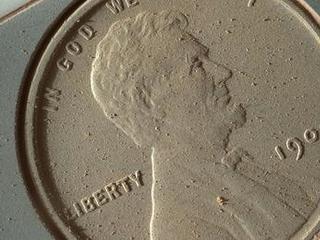 This image of a U.S. penny on a calibration target was taken by the Mars Hand Lens Imager (MAHLI) aboard NASA's Curiosity rover in Gale Crater on Mars. At 14 micrometers per pixel, this is the highest-resolution image that MAHLI can acquire.
