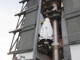 NASA's MAVEN (Mars Atmosphere and Volatile EvolutioN) spacecraft, inside a payload fairing, is hoisted to the top of a United Launch Alliance Atlas V rocket at the Vertical Integration Facility at Cape Canaveral Air Force Station's Space Launch Complex 41.
