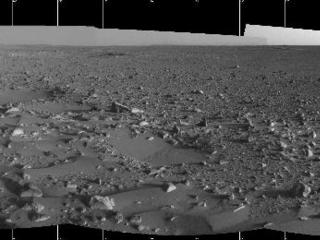 This image highlights the bumpy terrain surrounding the rover.