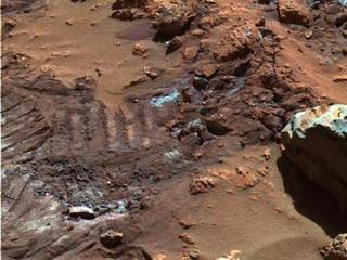 This false-color image highlights mysterious and sparkly dust-like material that is created when the soil in this region is disturbed.