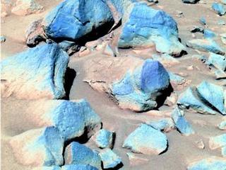 This false-color image taken by Spirit shows a group of darker rocks dubbed "Toltecs," lying to the southeast of the rover's position.