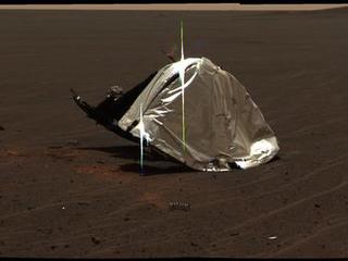 This image from Opportunity's panoramic camera features the remains of the heat shield that protected the rover from temperatures of up to 2,000 degrees Fahrenheit as it made its way through the martian atmosphere.