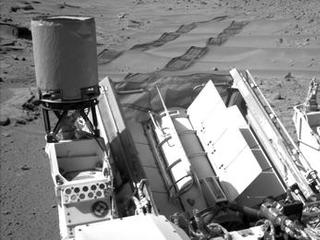 ASA's Curiosity Mars rover used the Navigation Camera (Navcam) on its mast to catch this look-back eastward at wheel tracks from driving through and past "Dingo Gap" inside Gale Crater.